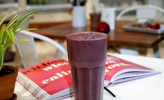 The 2024 Guide to Adaptogenic Smoothies: Stress Relief, Hormonal Balance, and Wellness for Women A woman enjoying a smoothie made with adaptogenic herbs, supporting stress relief and hormonal balance.