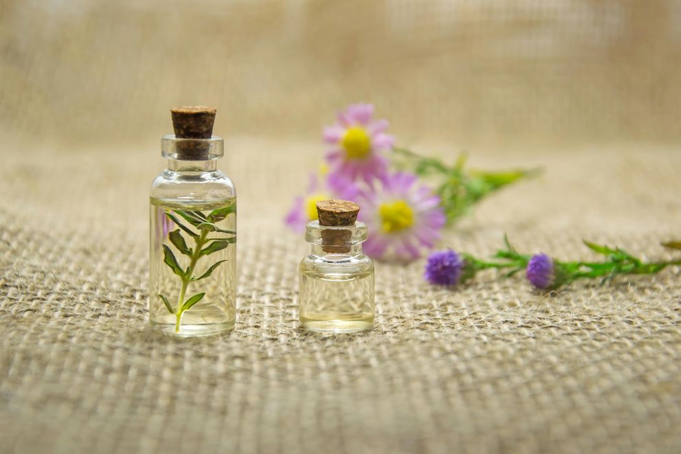Aromatherapy for Weight Loss in Women: Essential Oils for 2024 Weight Loss Goals A woman using essential oils for weight loss, including peppermint, grapefruit, and lavender, as part of her healthy lifestyle.