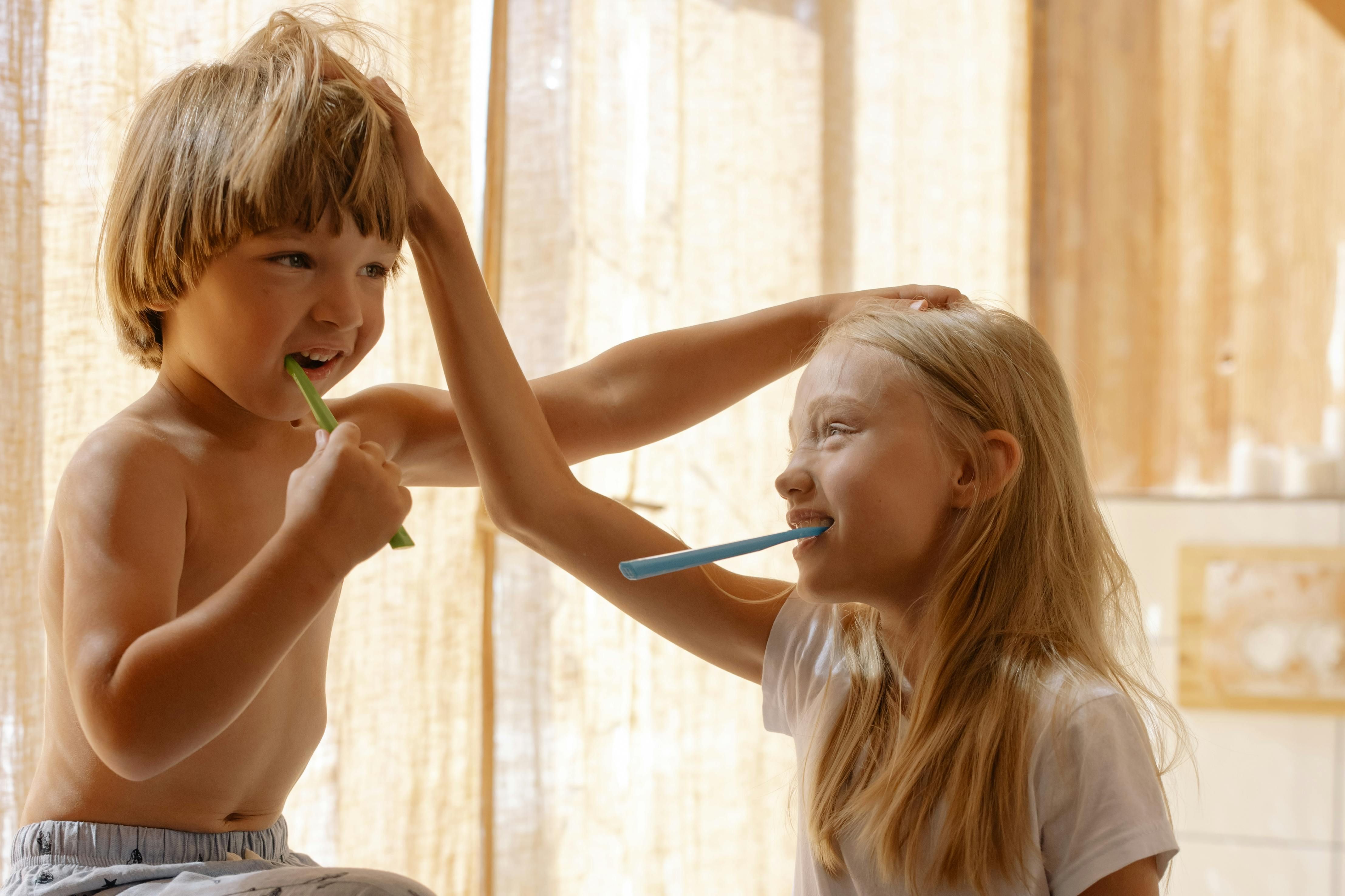 Children Brushing Teeth - Oral Care for Intermittent Fasting Women Young children brushing teeth, demonstrating proper oral hygiene technique
