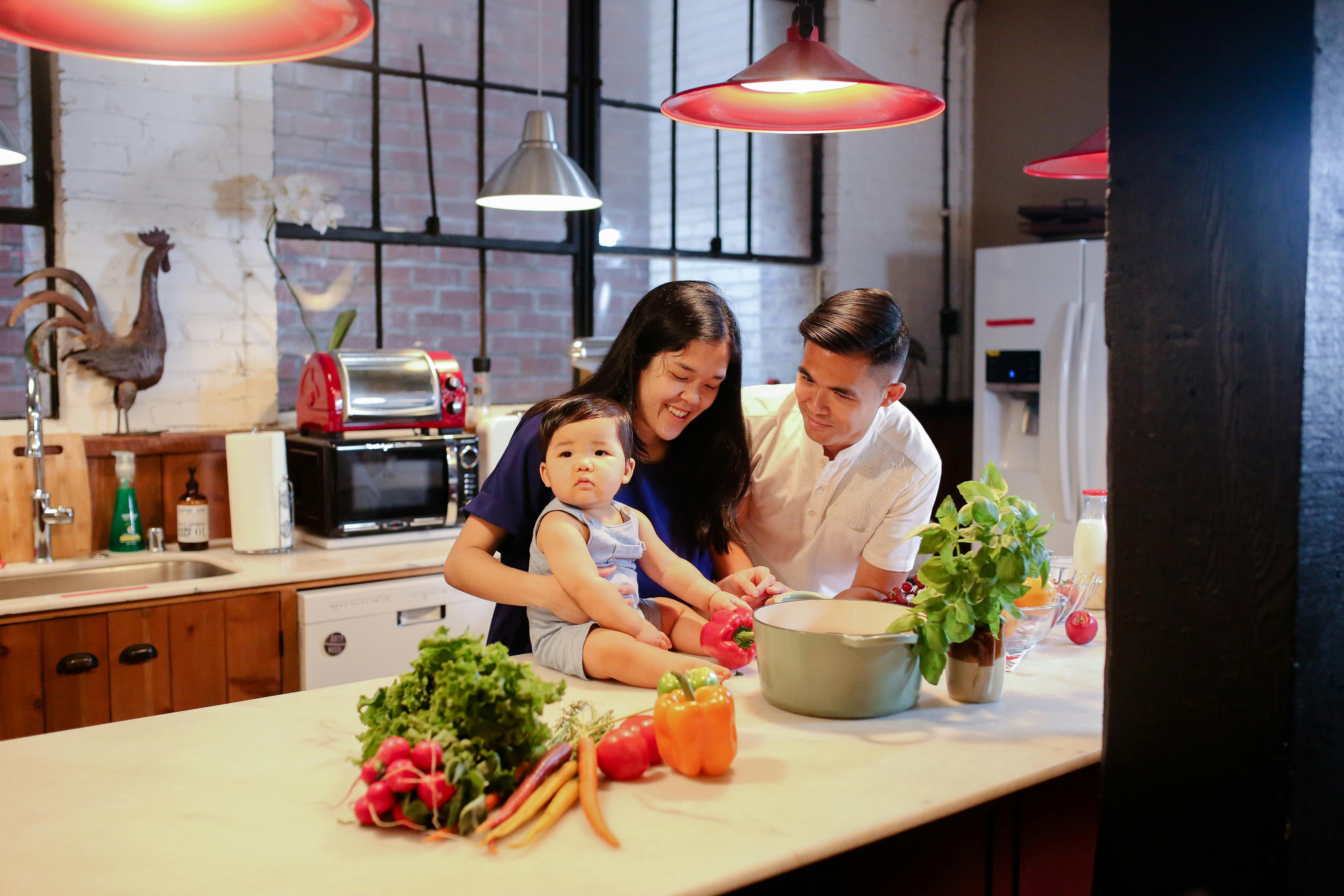 Family Cooking Together: Preparing Healthy Meals to Support Circadian Fasting A family cooking together in the kitchen, showcasing the importance of preparing healthy meals as part of a circadian fasting routine.