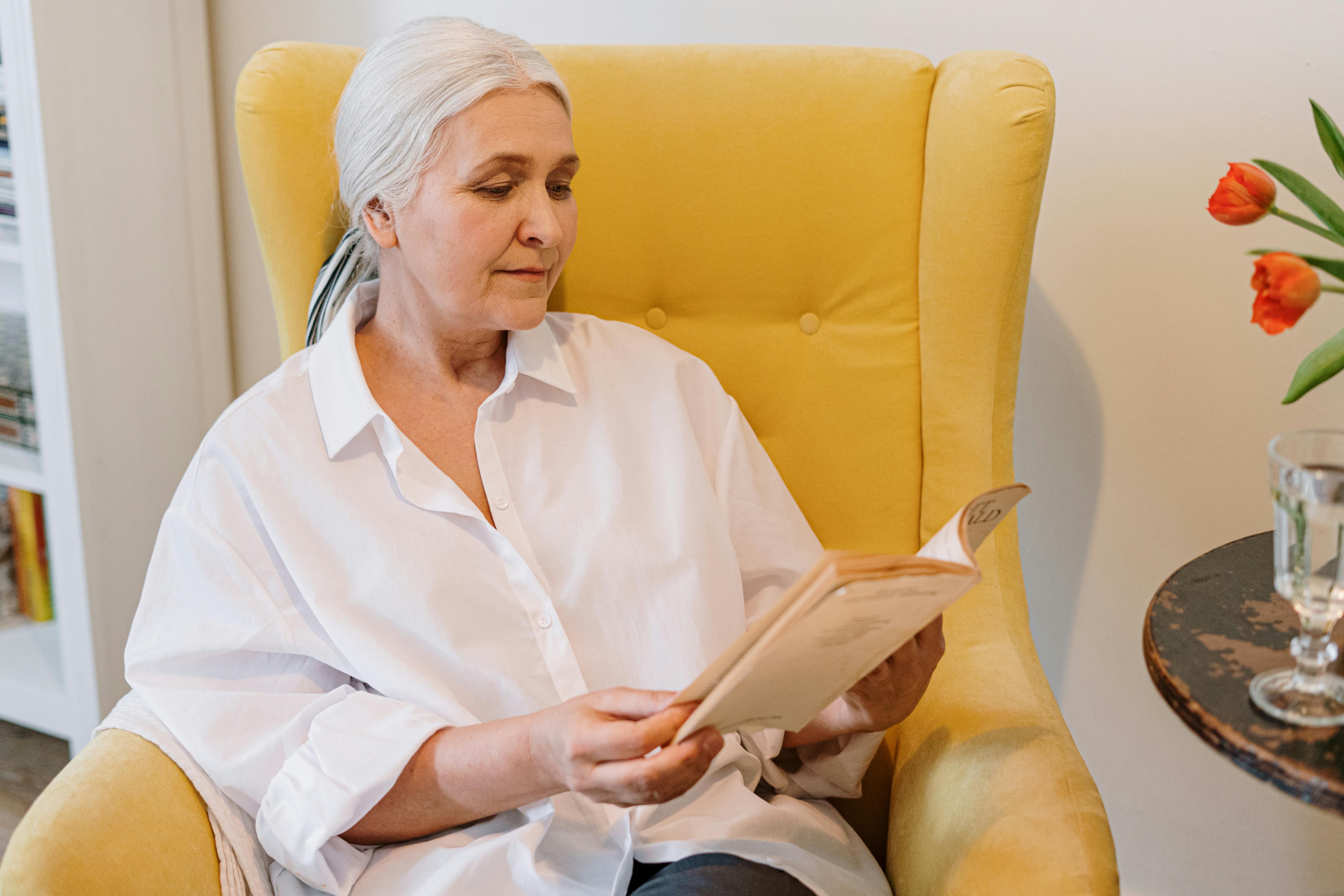 Woman Enjoying Reading About the Carnivore Diet for Women Over 50 Happy woman reading about the carnivore diet