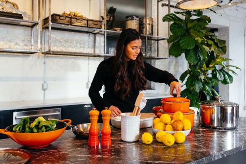 A Woman Cooking Healthy Foods in the Kitchen