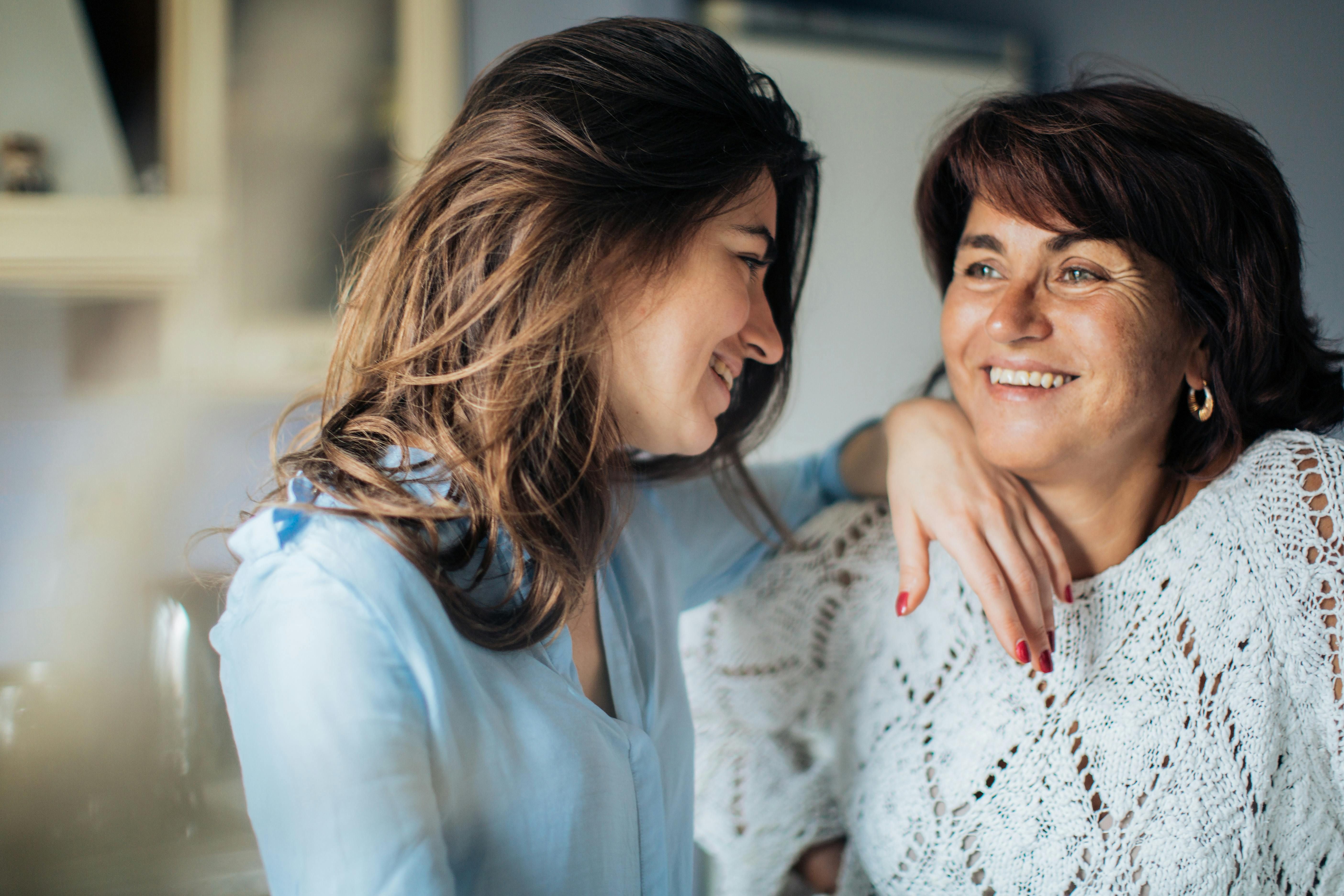 Mother and Daughter Bonding: Understanding the Impact of the Mother Wound on Their Relationship A mother and daughter together, reflecting on their relationship and working through emotional healing.