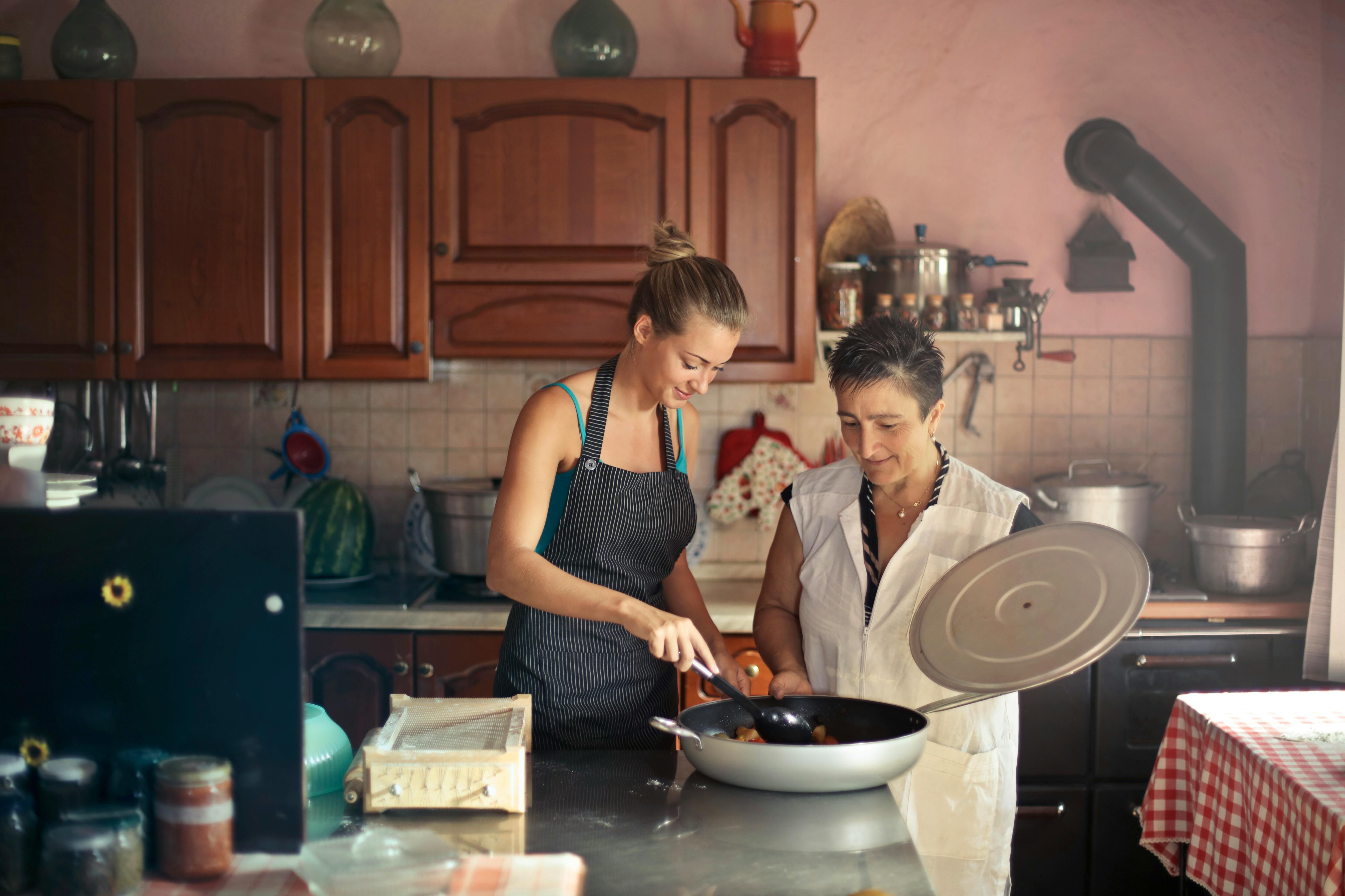 Mother and daughter preparing a meal together for their intermittent fasting schedule
