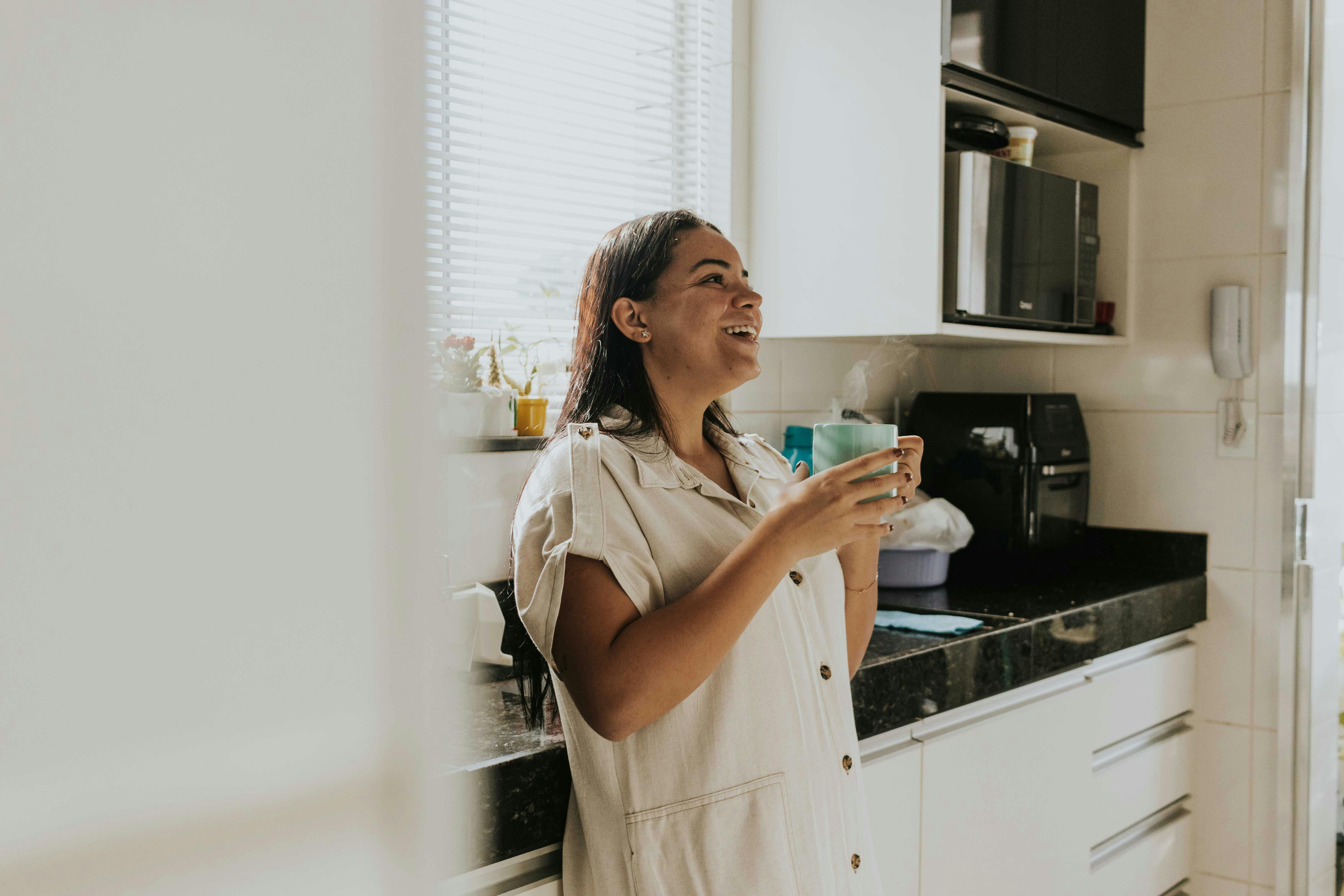 Woman Drinking Coffee: Enjoying Caffeine While Staying Hydrated and Balanced A woman enjoying a cup of coffee while staying mindful of hydration, balancing caffeine intake for better health.