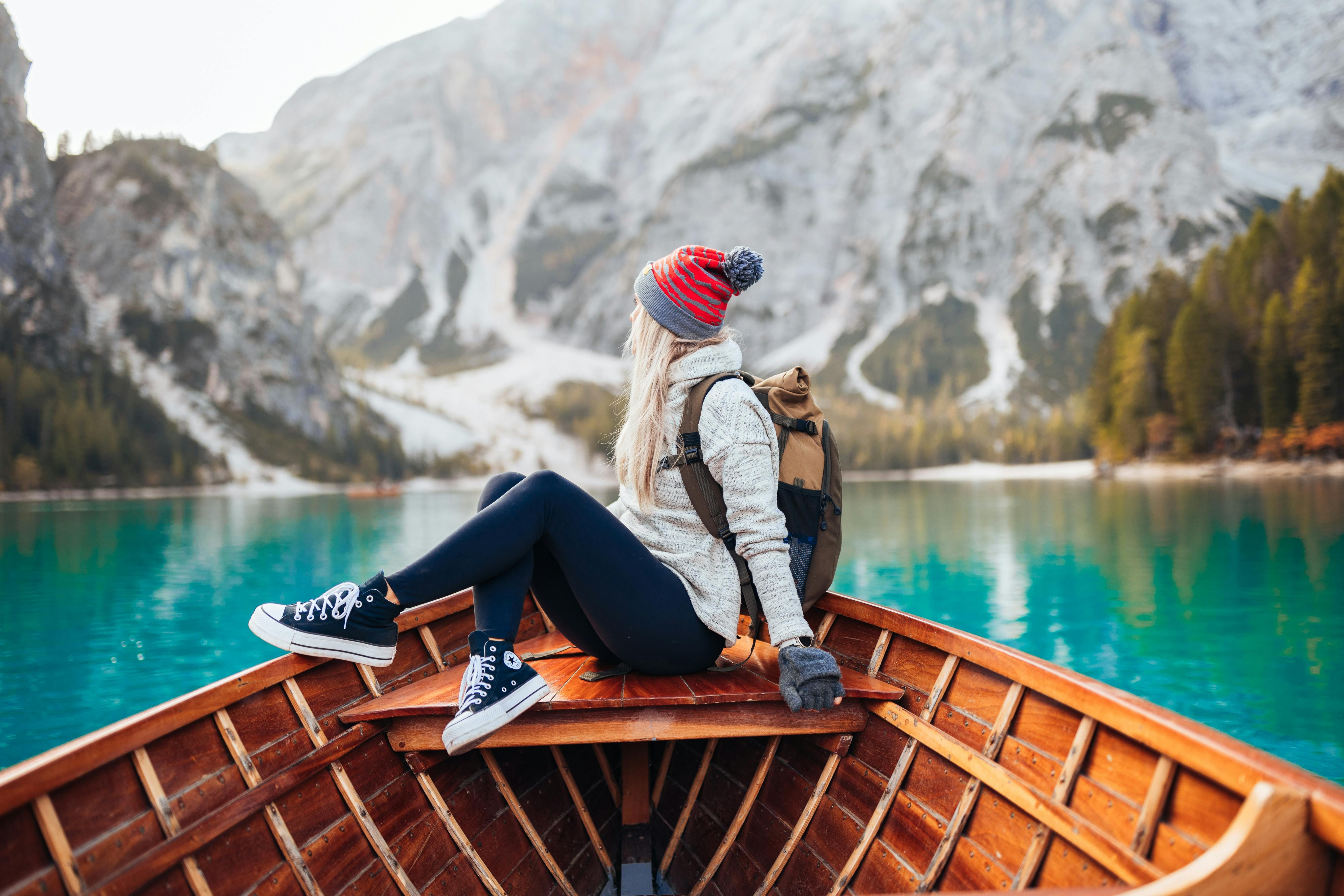 Woman Embracing Nature Therapy in the Mountains: The Healing Power of the Outdoors for Mental Health A woman peacefully enjoying the view of the mountains, embracing the mental and emotional benefits of nature therapy.